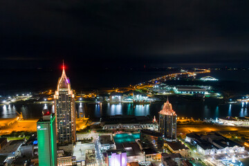 Obraz premium Downtown Mobile, Alabama and the bay at night during Mardi Gras Month