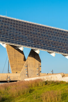 Large-scale photovoltaic pergola in Barcelona, Spain, harnessing solar energy efficiently. A striking fusion of infrastructure and environmental consciousness.