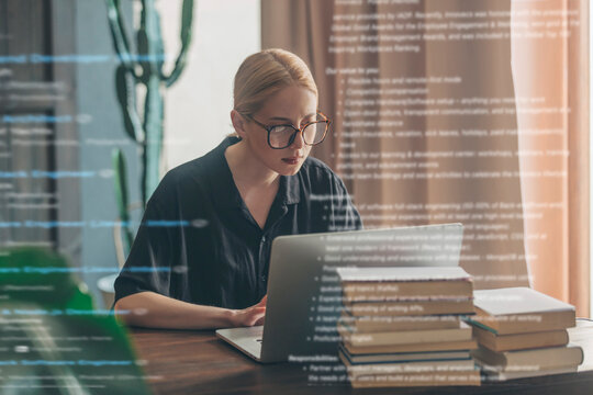 Woman working on a laptop at home searching for a job