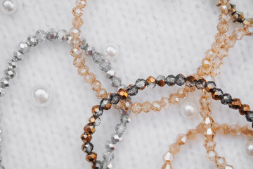 Beautifully crafted beaded bracelets on a soft textured surface