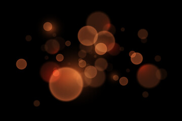 Abstract glowing bokeh lights. Bokeh and magic light effect. On a black background.