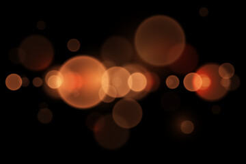 Abstract glowing bokeh lights. Bokeh and magic light effect. On a black background.