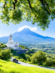 Church sits under volcano; car drives past. Travel background, worship service use
