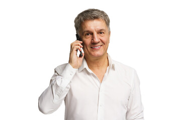 Middle-aged man smiling while talking on a smartphone in a bright, neutral setting