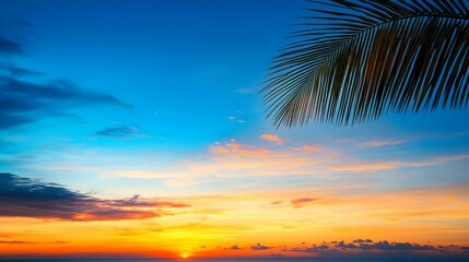 Fototapeta premium Vibrant Sunset Over Tropical Beach with Palm Tree Silhouette