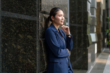 Confident Asian Businesswoman Looking Forward with Determination. Professional Corporate Portrait...