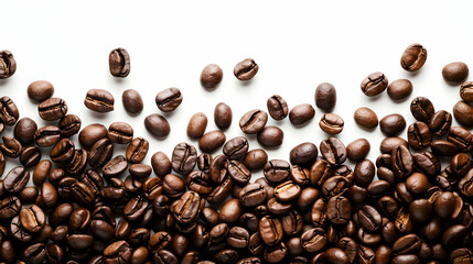 Naklejka premium Close-up of roasted coffee beans scattered on a white background, highlighting rich textures and colors