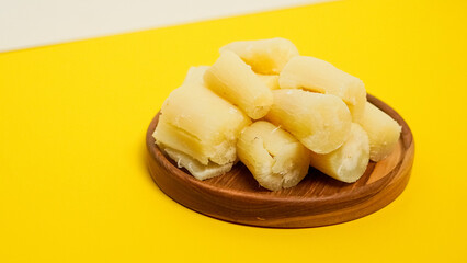 boiled cassava in yellow background