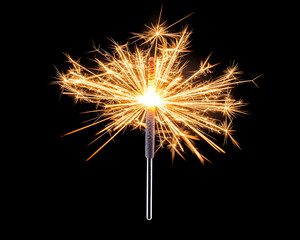 Fototapeta premium Sparkler burning brightly against black background. Celebration, festive mood, bokeh