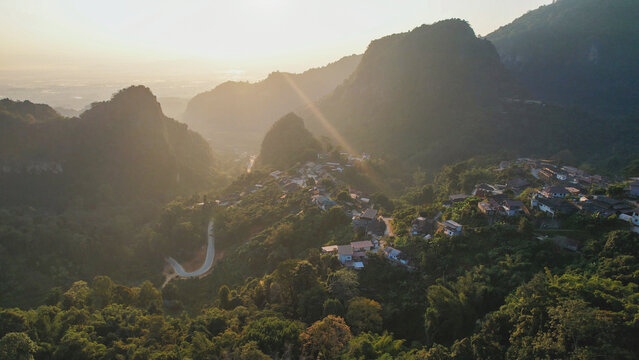 Aerial view from drone of the rural village in the mountains before sunrise