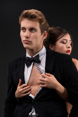 Sexy couple embracing view on dark background