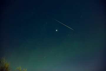 Aurora borealis, polar lights with Milky Way stars.