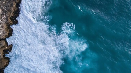 Obraz premium Aerial view of crashing ocean waves against rocky coastline in a tropical paradise : Generative AI