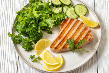 grilled tuna steak on a plate, top view