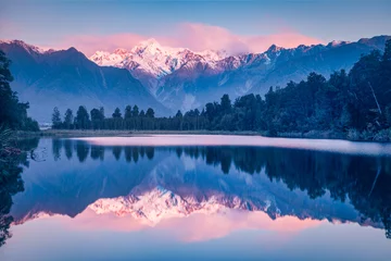 Lake Matheson and Mount Cook, New Zealand's highest mountain, reflecting in the lake.