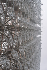 Radar arc in Chernobyl. Old collapsing radar antenna on sky background