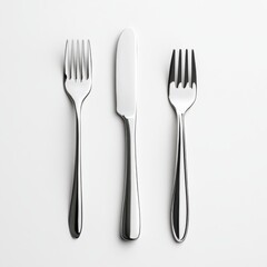 Elegant Stainless Steel Knife and Forks Arranged on a Minimalist White Background for Dining Decor