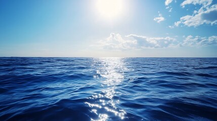 Obraz premium Expansive view of a tranquil ocean with glimmering sunlight reflecting on the water under a cloudy sky : Generative AI