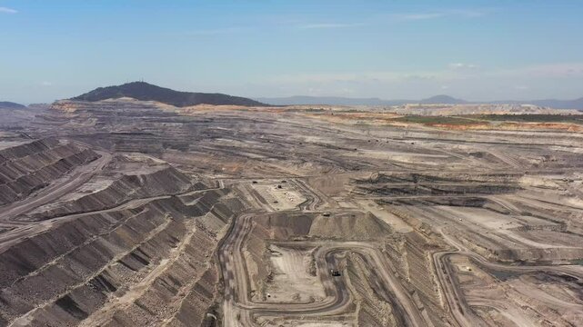 Fast flying over deep open pit black coat mine in Hunter valley of Australia aerial 4k.

