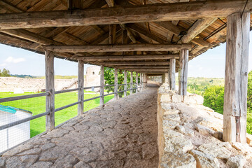 Ancient weathered rough stone walls and tower of the Izborsk fortress, Izborsk, Pskov region, Russia