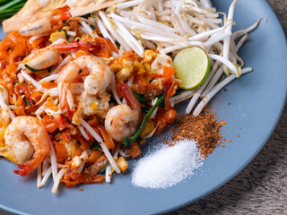 Pad Thai is a stir fry rice noodles with shrimp. Popular Thai street food.