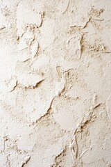 Fototapeta premium Close-up of textured beige stucco wall surface.