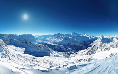 Naklejka premium A breathtaking panoramic view of the Alps with a clear blue sky
