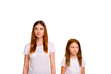 Portrait of minded ladies with long haircut looking having thoughts isolated over yellow background