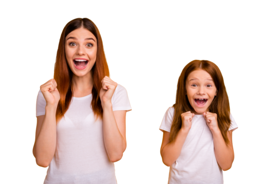 Portait of crazy people raising fists screaming wow omg wearing white t-shirt isolated over yellow background