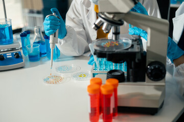 Lab work, Doctor holds a test tube takes the test from a test tube in analysis, blood, DNA, test tube stand..