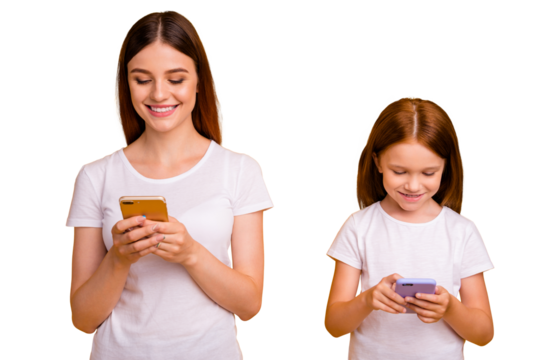 Portrait of cheerful people with ginger hair using modern technology wearing white t-shirt isolated over yellow background