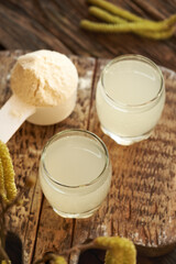 Fresh natural whey in a two glasses - protein rich healthy nutritional supplement