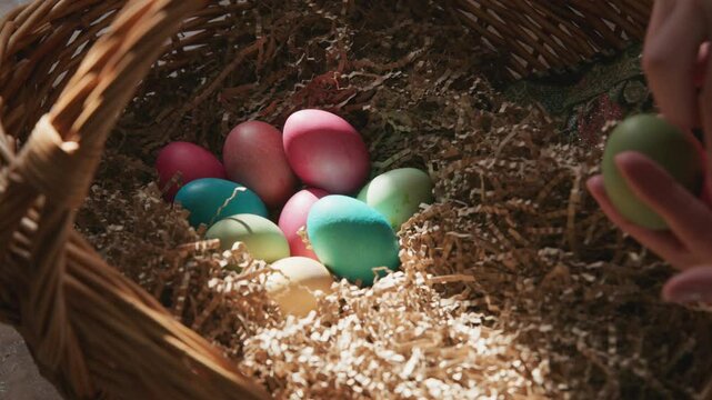 Finding colorful eggs in a basket during an Easter celebration activity