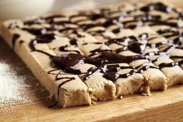 Closeup of homemade no-bake protein bars made of whey protein powder and ground oat flakes