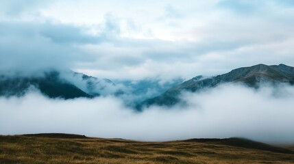 Majestic mountains covered in fog and mist under a cloudy sky : Generative AI
