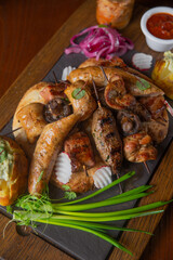 Deep fried battered snacks for beer on a wooden tray on the table