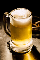 glass of beer on dark background