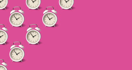 White alarm clocks on violet red background, pattern. Banner design with space for text
