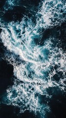 Fototapeta premium Serene Aerial View of Turquoise Ocean Waves and White Foam Patterns