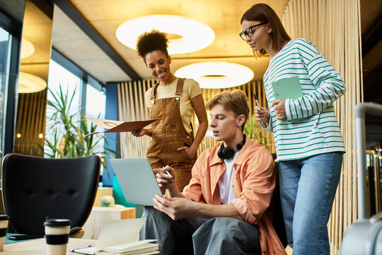 Colleagues collaborating in a trendy hotel setting during a productive business trip