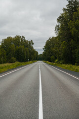 Fototapeta premium An empty road in the mountains at sunset
