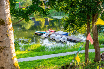 Pier with boats on Lake Tobolenets in the Pushkin Mountains
