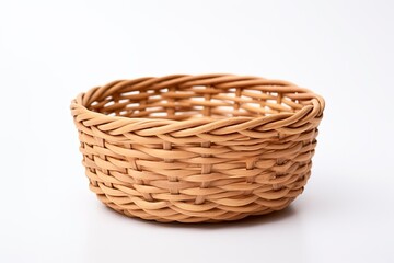 Obraz premium Top view of a handmade brown wicker basket empty and isolated on a white background Made from eco friendly natural materials