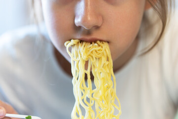 unhealthy fast food. nutrition of schoolchildren. Cute asian child girl eating delicious instant...