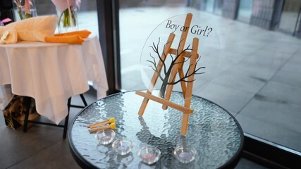 Family tree at a gender reveal party for a little new boy or girl. Pink and blue paint close up. Celebrating the birth of a baby