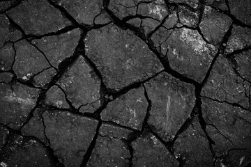 Obraz premium Cracked Asphalt and Broken Rocks Texture in Black and White