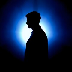 Silhouette of Man in Blue Light with Glowing Halo