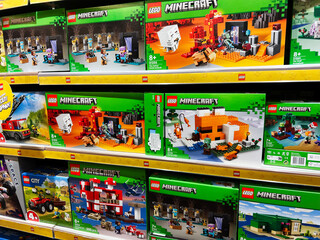 Naklejka premium Lviv, Ukraine - February 16, 2025: Lego Minecraft sets displayed on a store shelf with colorful packaging