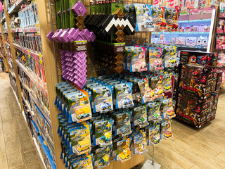 Naklejka premium Lviv, Ukraine - February 16, 2025: Variety of toys including Minecraft and collectible cars displayed on store shelves