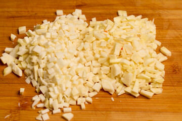 diced parsnip and parsley root on a wooden chopping board